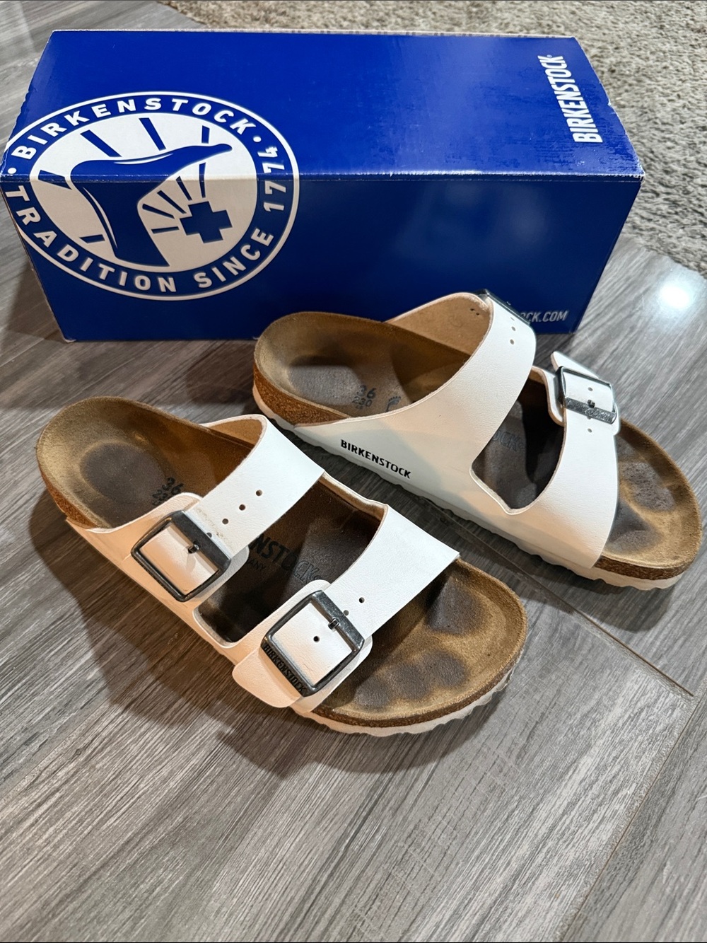 Birkenstock White Two-Strap Arizona Sandals with Silver Buckles